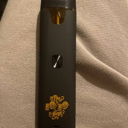 Black handheld vape device with gold decorative design