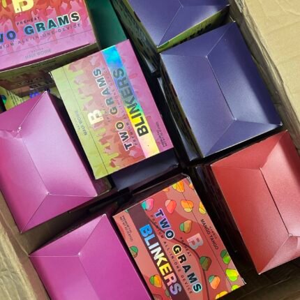Colorful packaged products arranged in a cardboard box